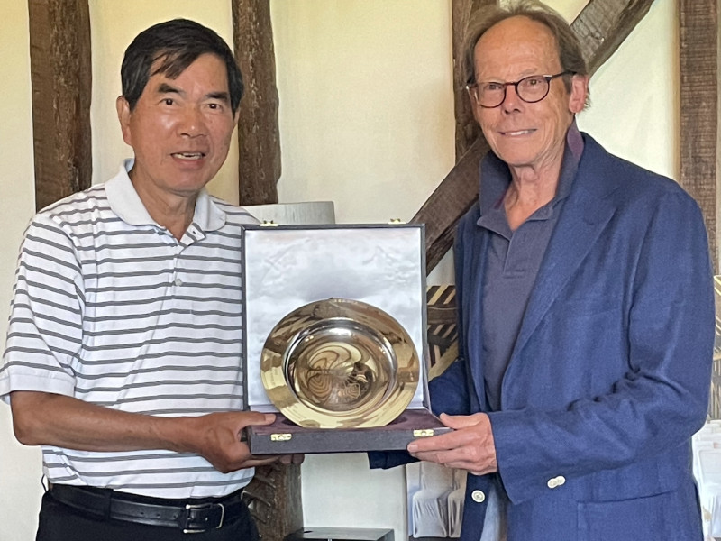 Japan Society golf captain James Lawson presents the Asprey and Garrard Plate to Eiji Wakiwaka